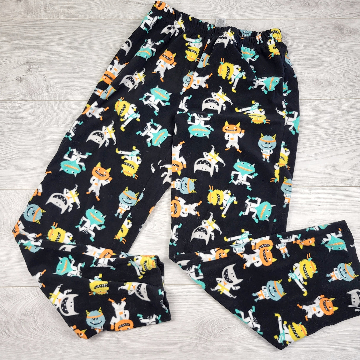 PS01 - Pantalon de nuit Carters en polaire noire à motifs monstres. Taille 42