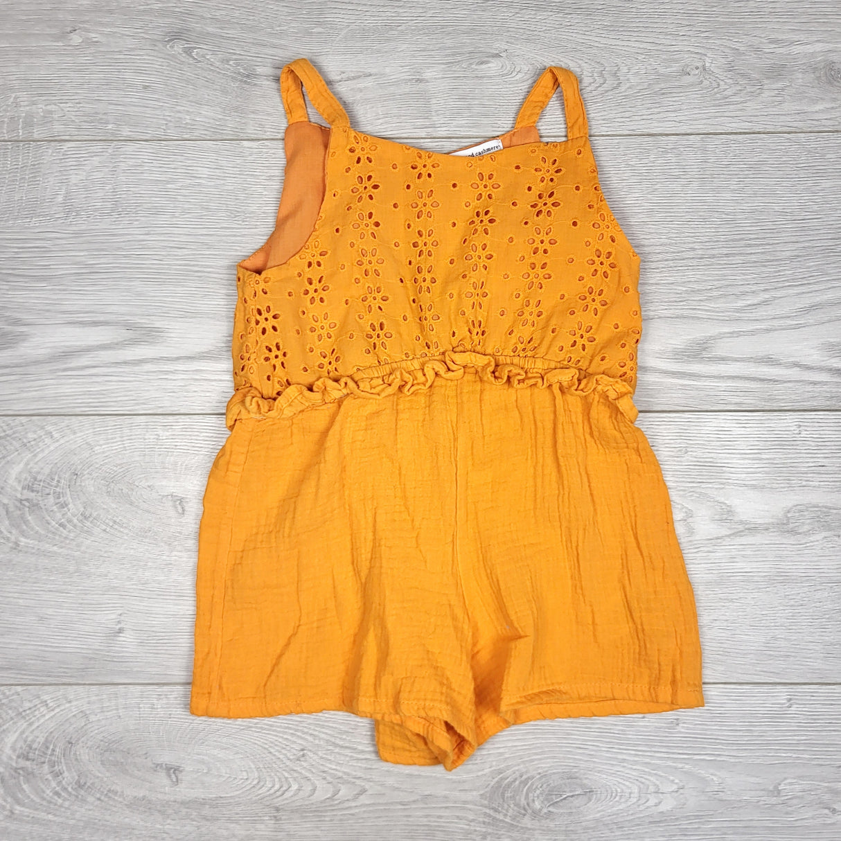 MHAN1 - Cupcakes and Cashmere orange romper with eyelet detail. Size 5/6