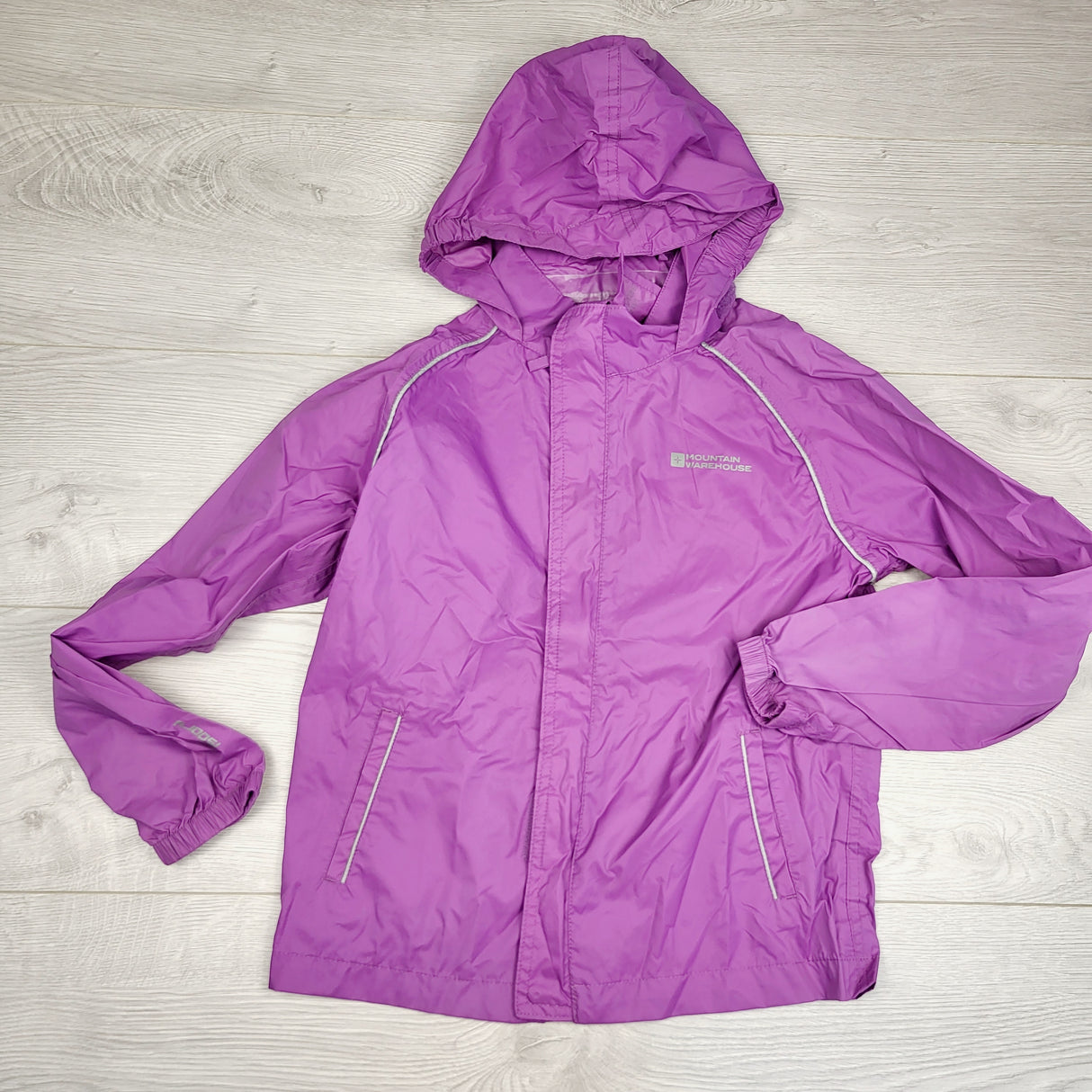 JUDM2 - Mountain Warehouse purple lightweight rain jacket. Size 9/10