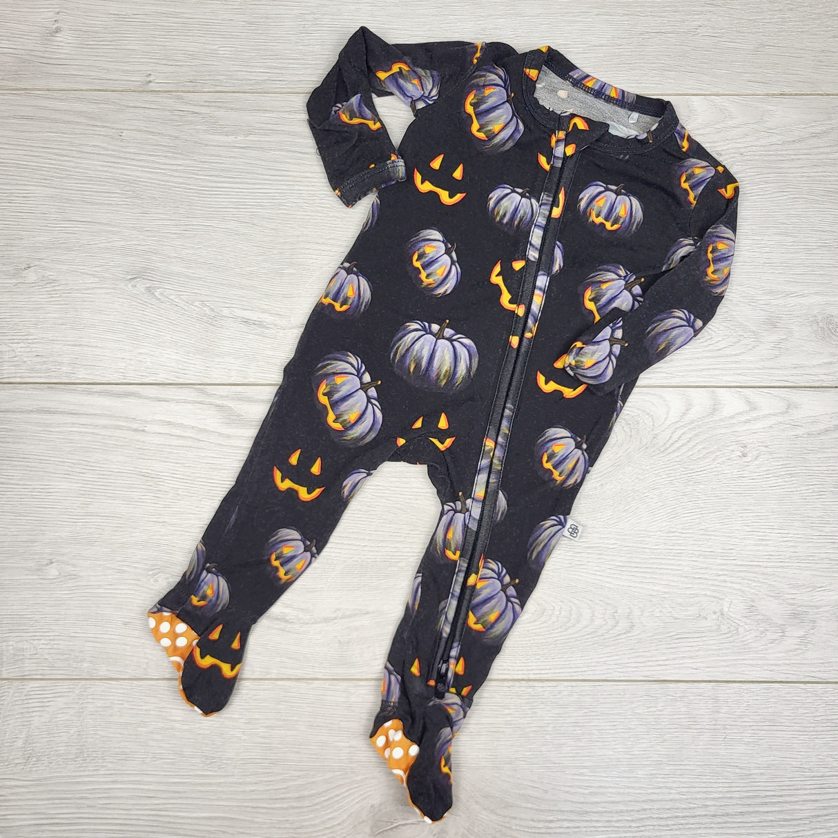 JRSH1 - Little Bums Bums black zippered bamboo sleeper with Jack-o-lanterns. Newborn size