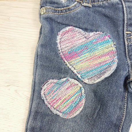 STML1 - Guess skinny jeans with embroidered hearts. Size 12 months