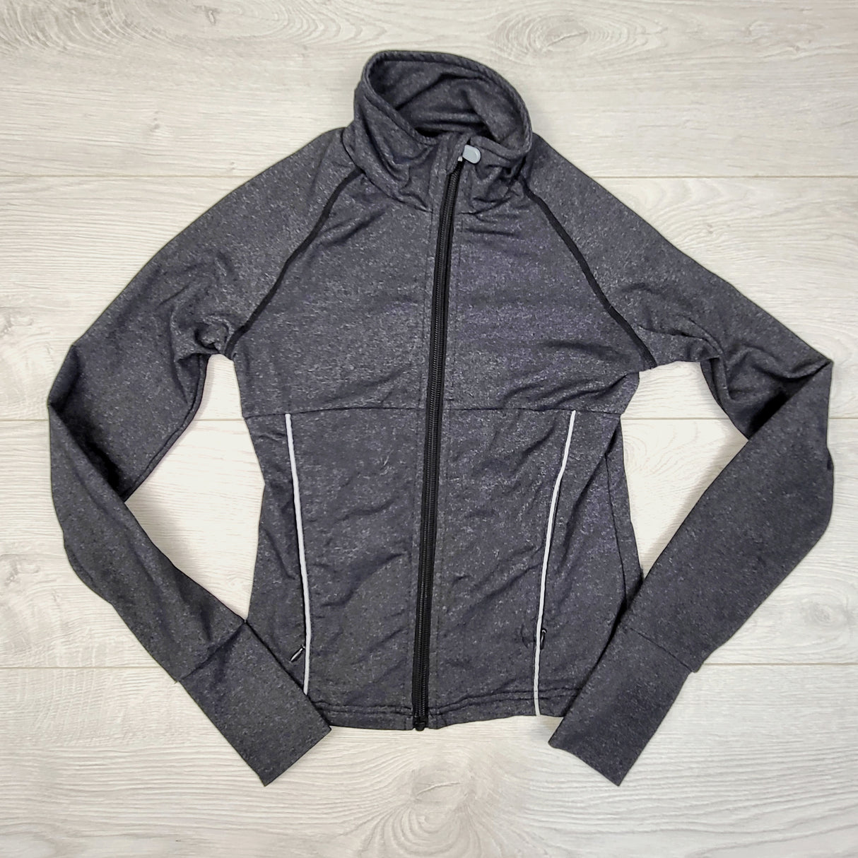 ESZ1 - Triple Flip grey active jacket. Their size 3 which is the same as a size 10