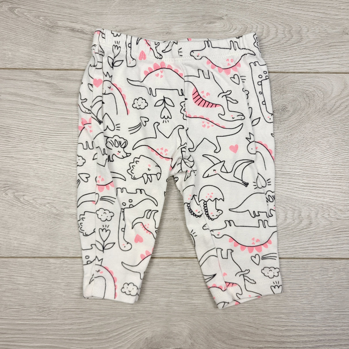 STML22 - Carters white leggings with dinosaurs. Size 3 months