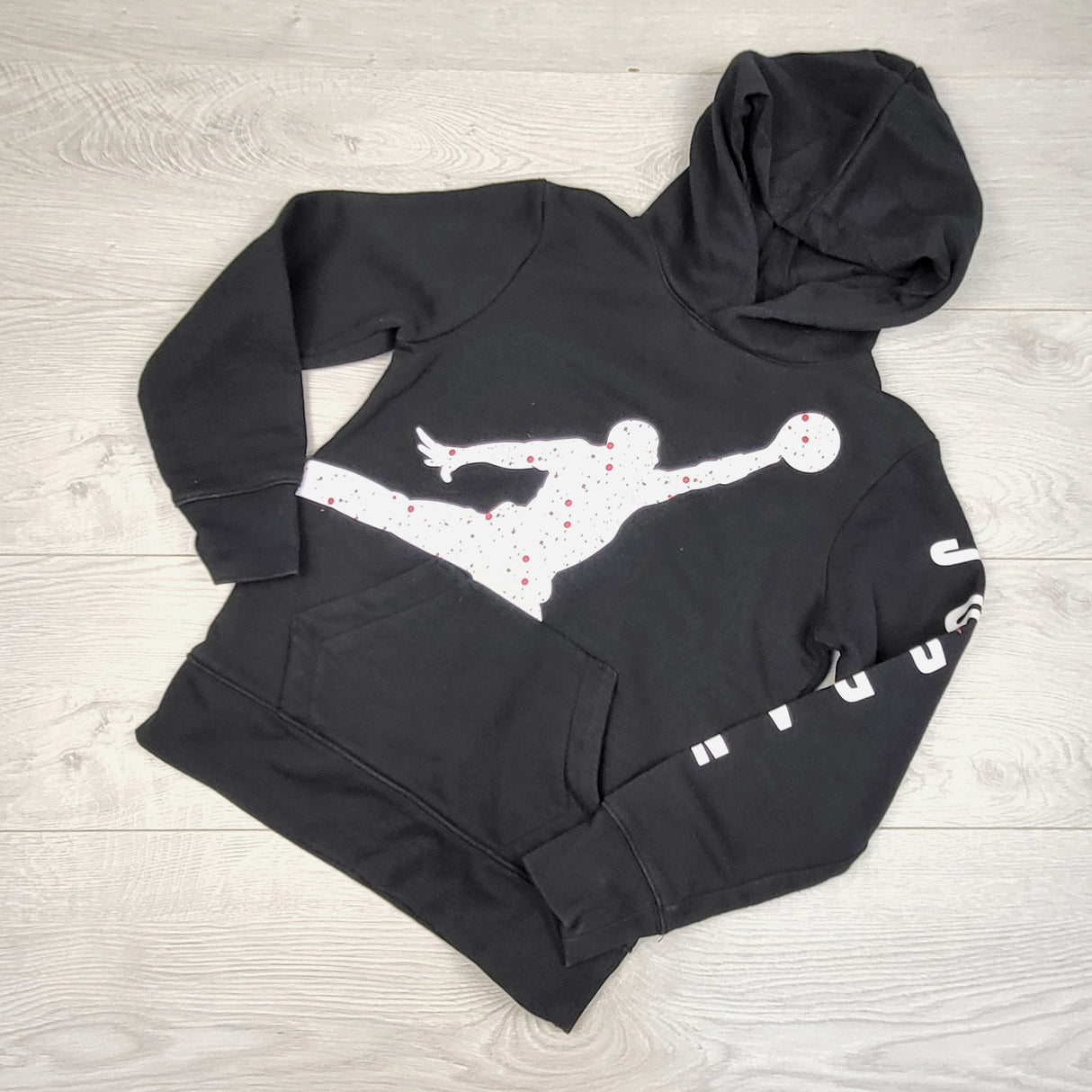 JUDM6 - Nike Air Jordan black fleece lined speckled jumpman pullover hoodie. Size 8-10 Years