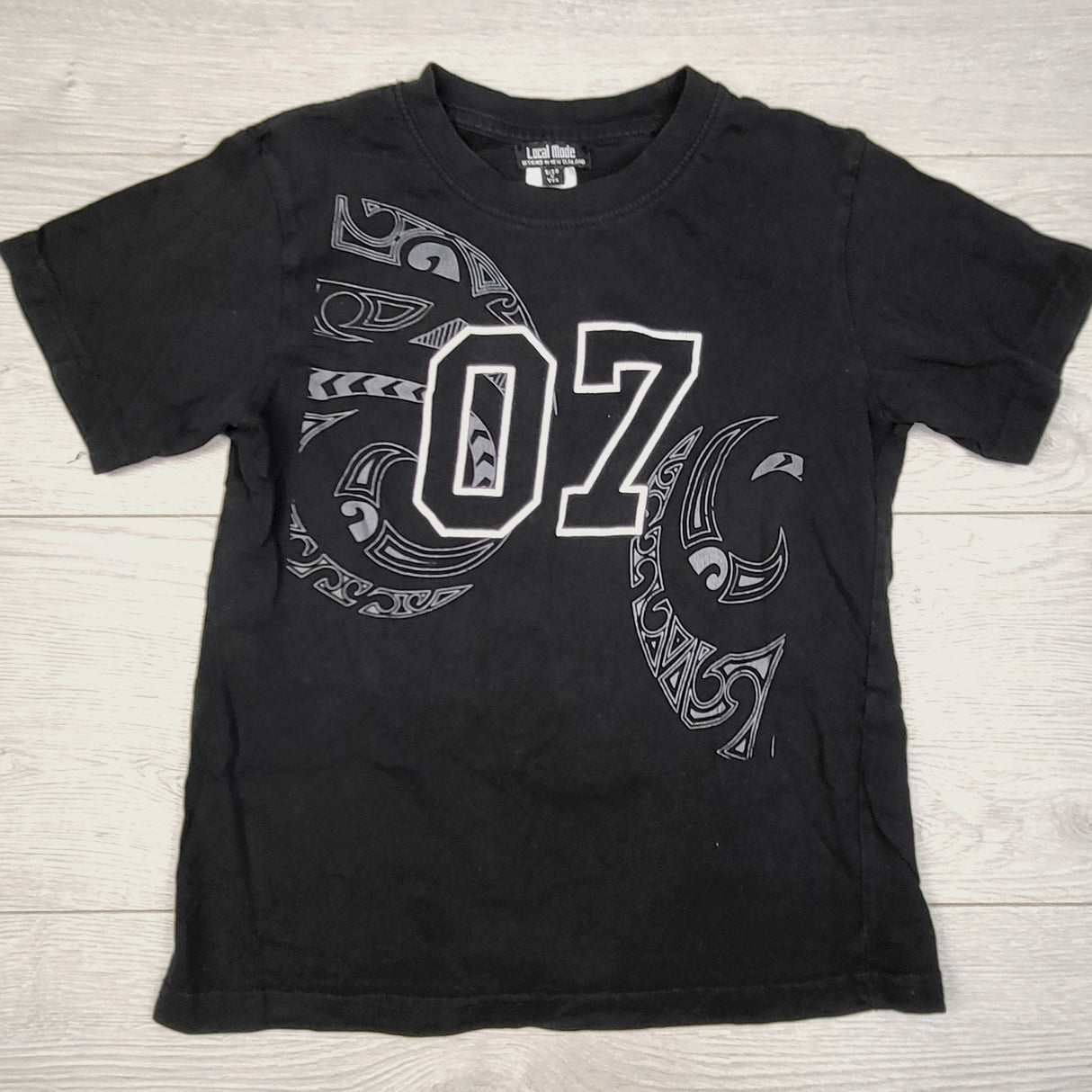 CBRD1 - Local Made brand black "07" t-shirt. Size 6