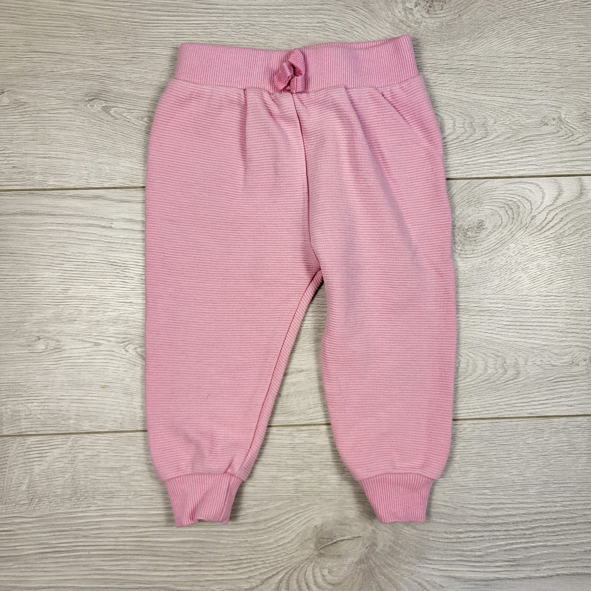 BBIN1 - Disney pink textured joggers. Size 9 months