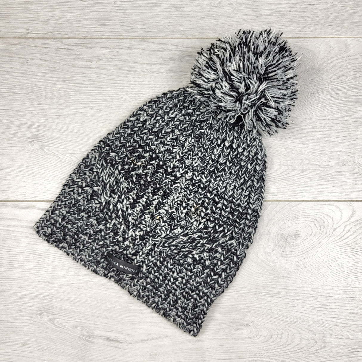 ESZ3 - Rebecca Minkoff black and white marled pom pom toque. One size fits all