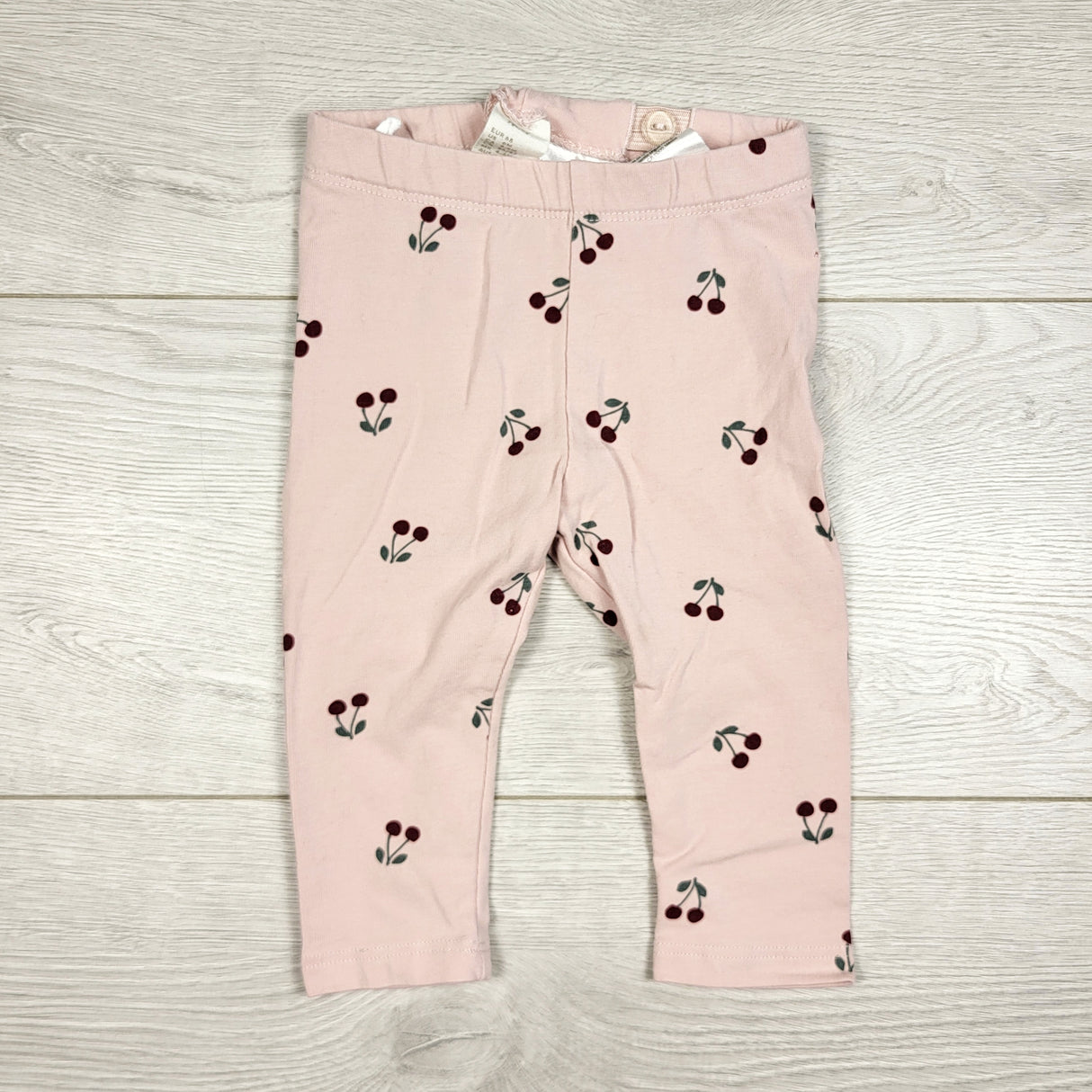 STHA1 - H and M pink leggings with cherries. Size 4-6 months