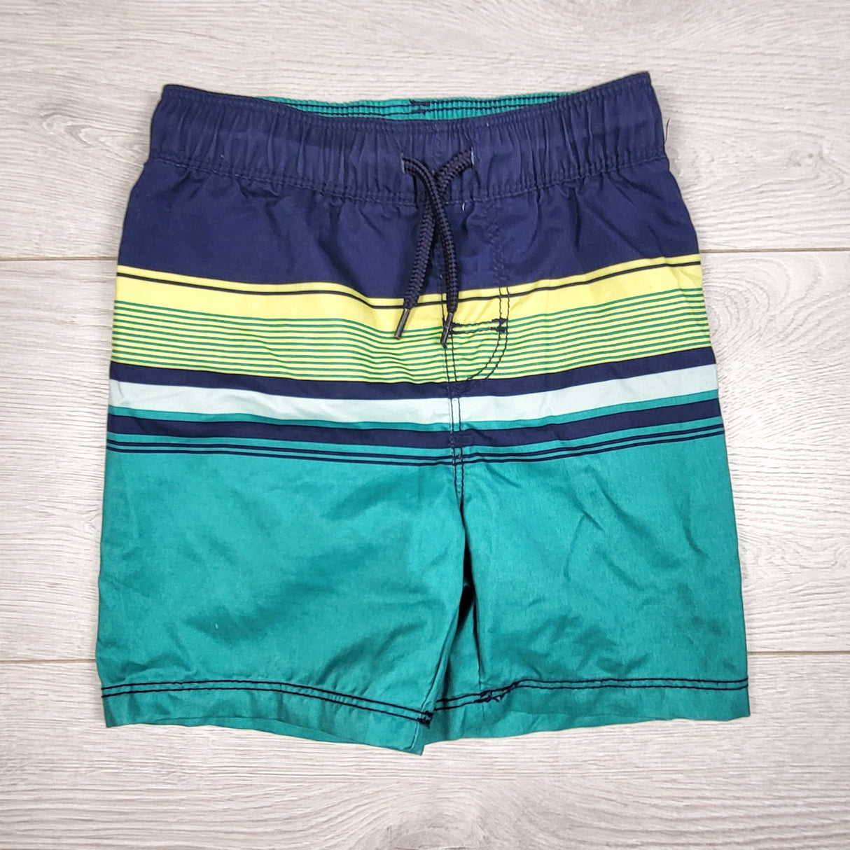 TSTB11 - Old Navy teal and navy striped swim shorts. Size 2T