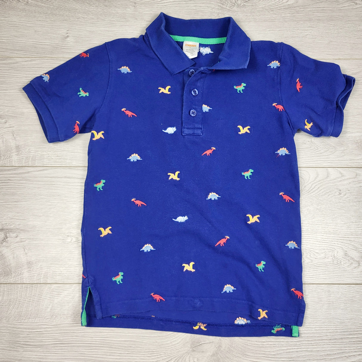 MBW1 - Gymboree blue polo shirt with dinosaurs. Size 7