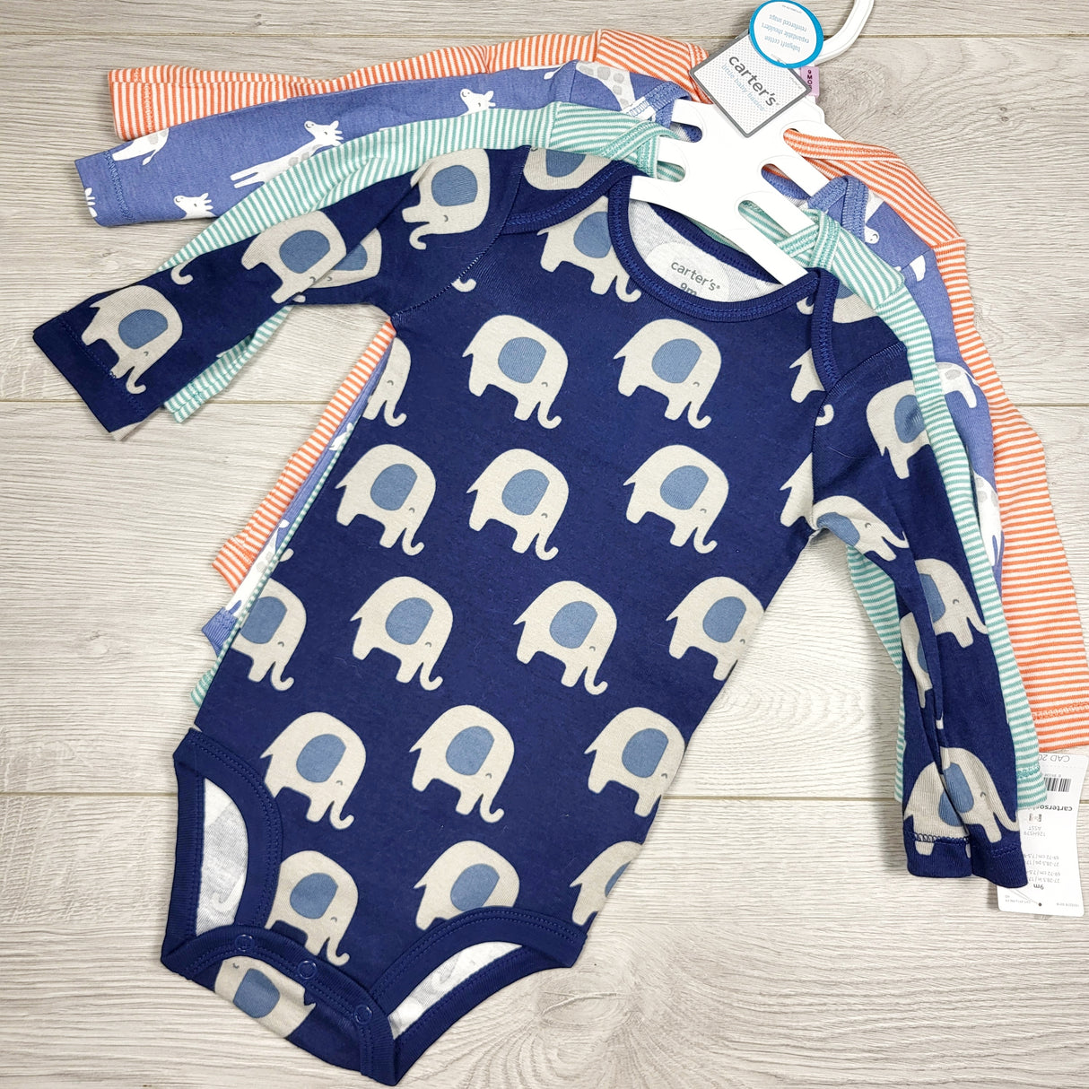 KAMG3 - NEW - Carters 4pc long sleeved bodysuit set. Size 9 months