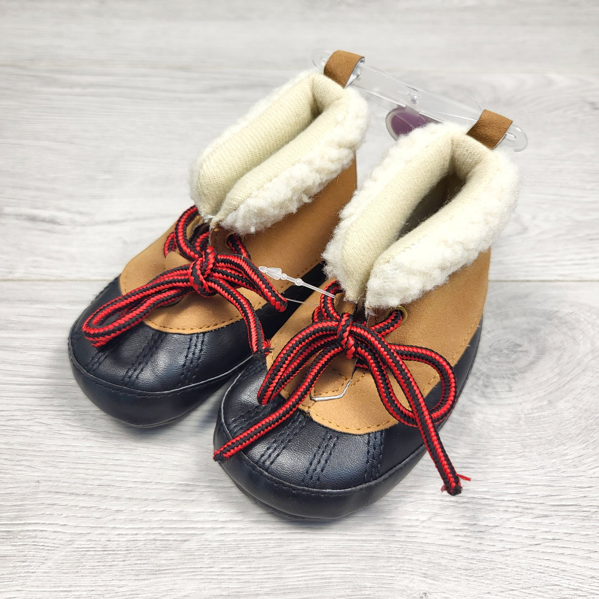 KAMG3 - NEW - Carters soft soled booties. Size 6-9 months (infant size 3)