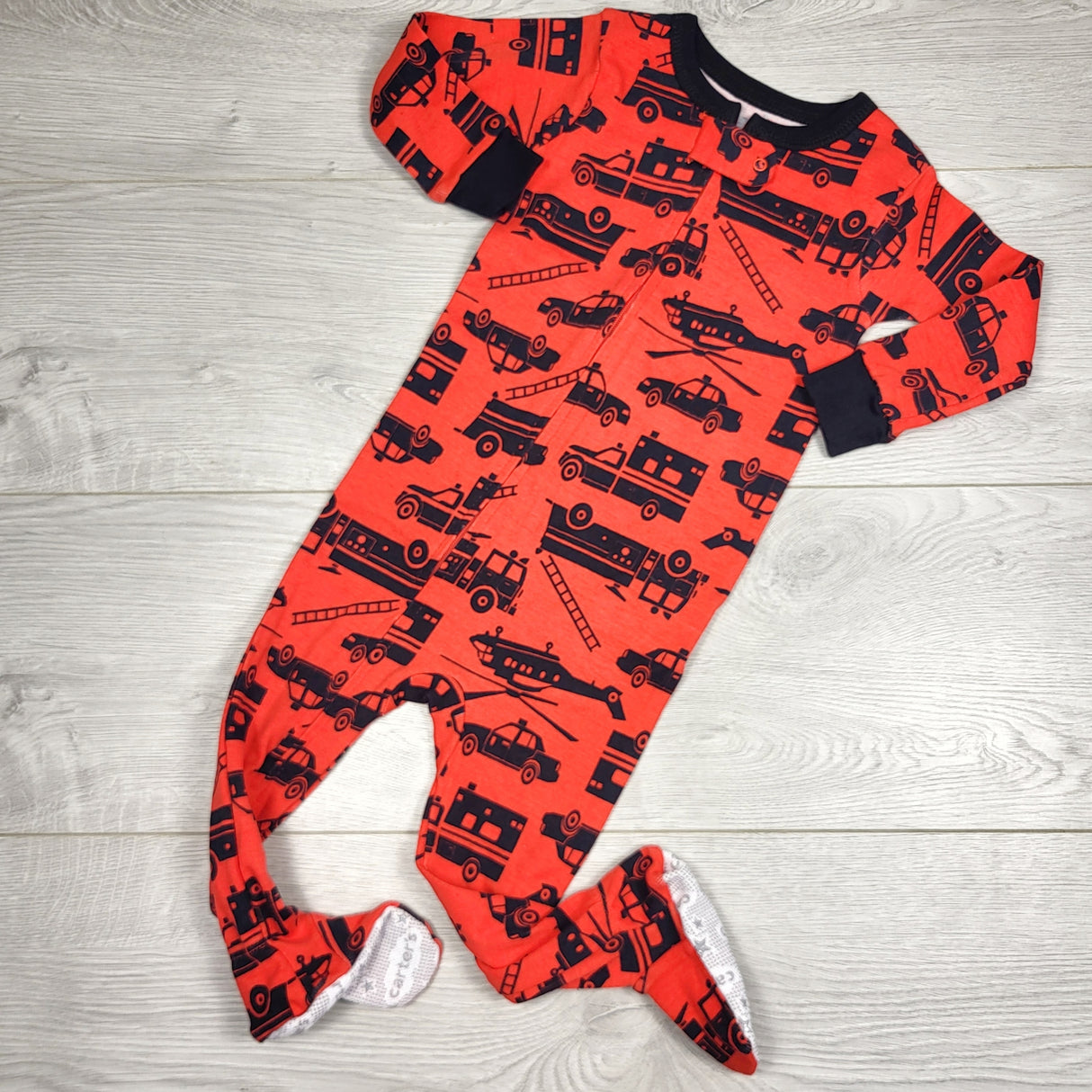 KAMG3 - Carters red zippered sleeper with fire trucks. Size 12 months