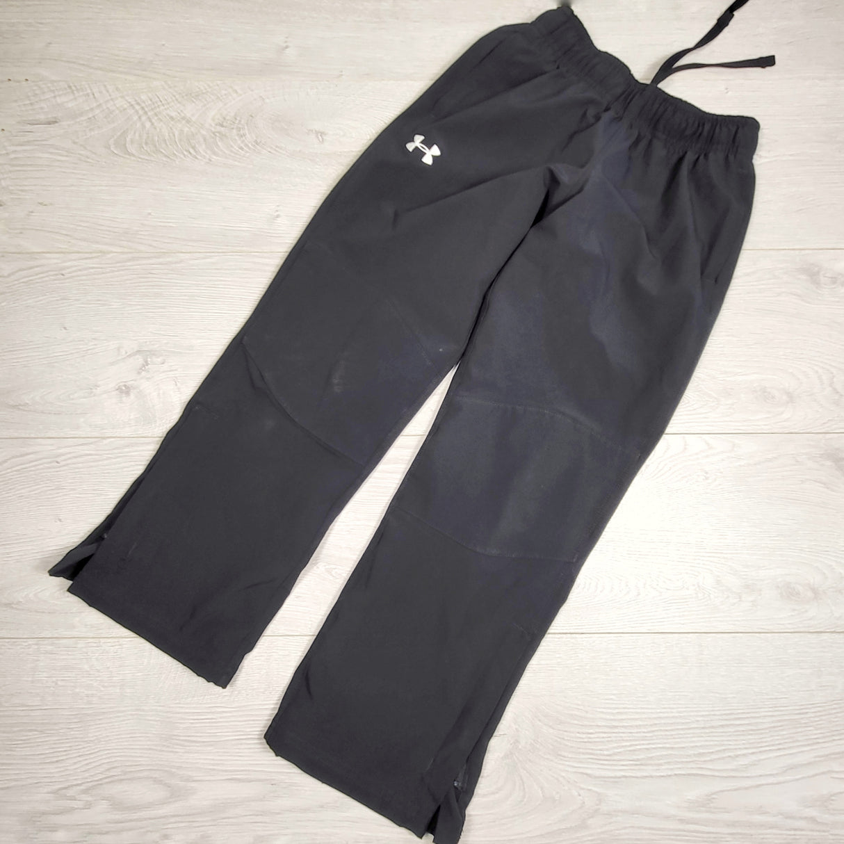 KHW1 - Under Armour black "Storm Team" warm up pants. Youth XS