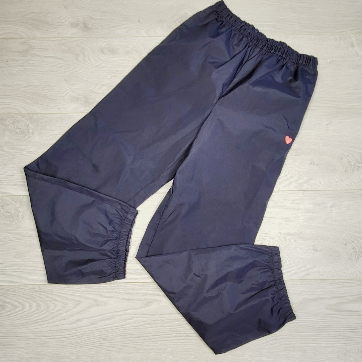 KHW22 - Oshkosh navy rain pants with heart. Size 10