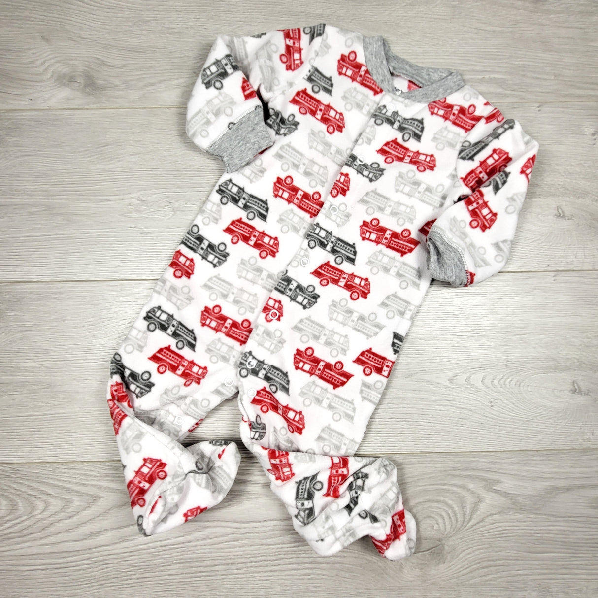 KAMG4 - Carters white fleece sleeper with fire trucks. Size 9 months