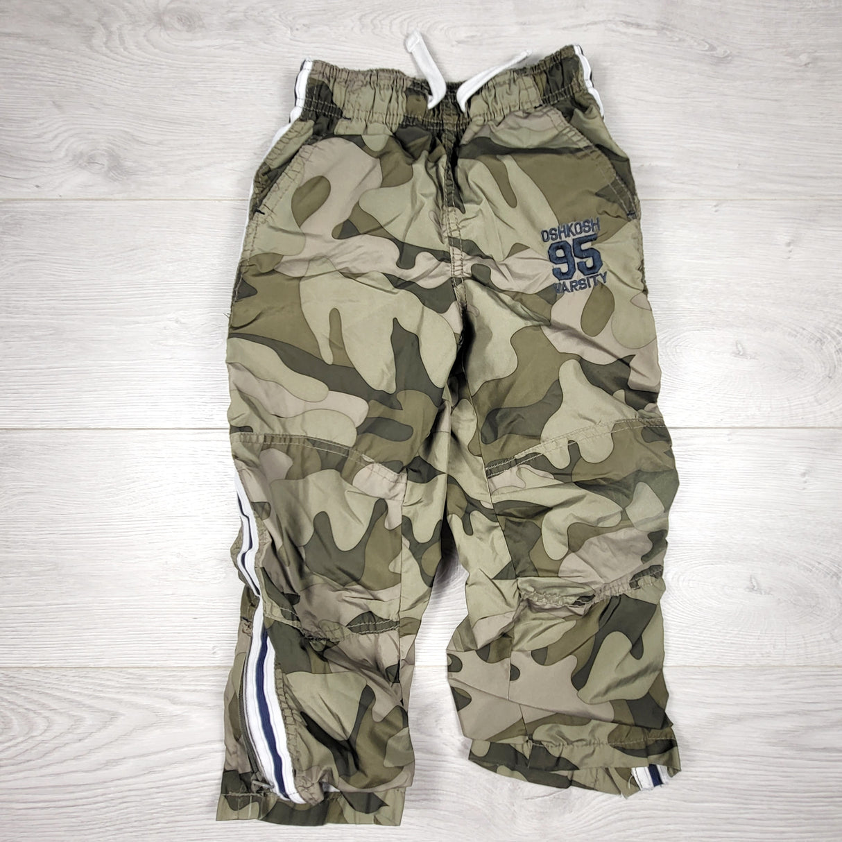 KAMG4 - Oshkosh jersey lined camouflage windbreaker style pants. Size 4T
