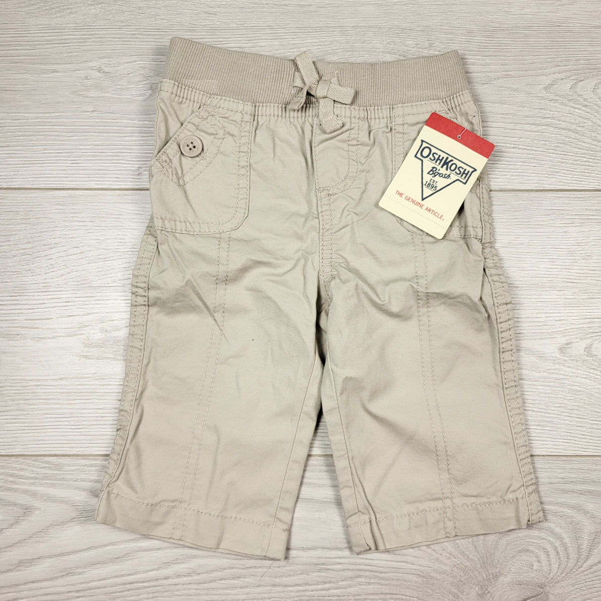 KAMG4 - NEW - Oshkosh khaki pull on pants. Size 6 months