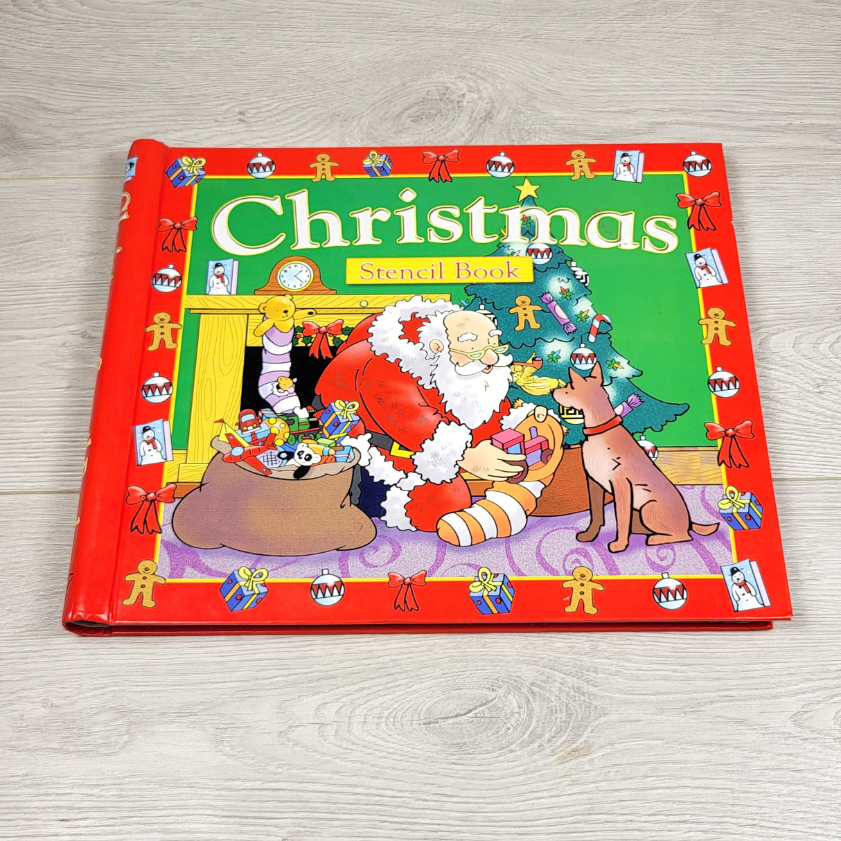 JEST1 - Christmas Stencil Book - hardcover storybook with a stencil on each page