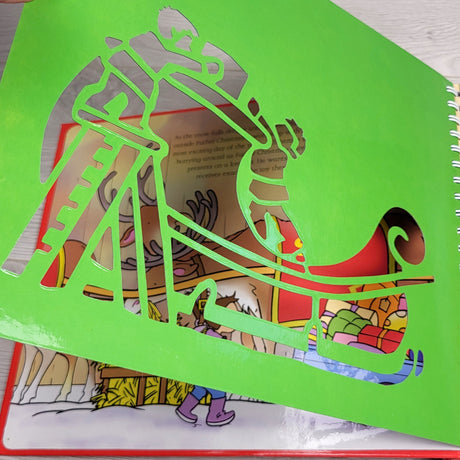 JEST1 - Christmas Stencil Book - hardcover storybook with a stencil on each page