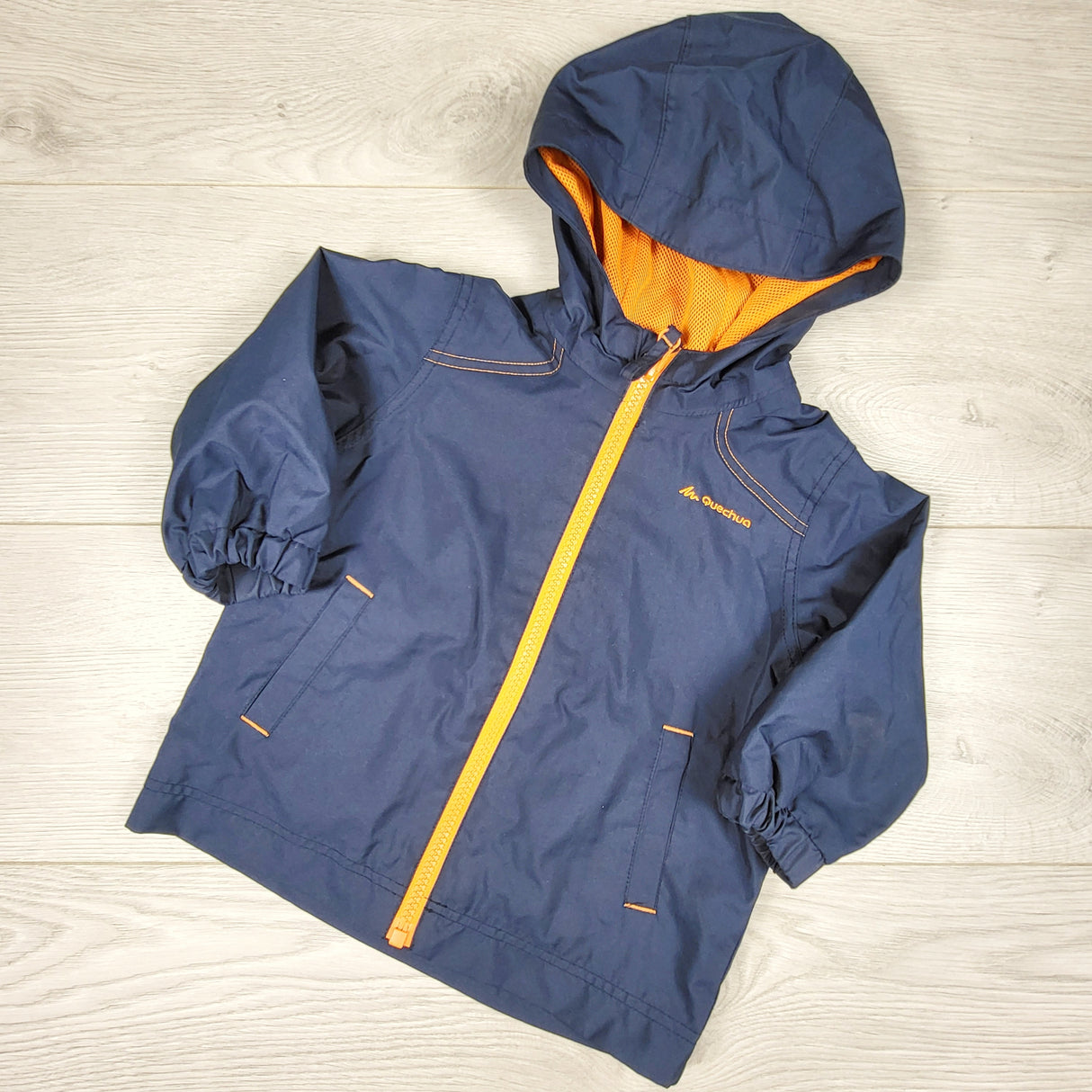 BHPP1 - Quechua navy hooded windbreaker style lightweight jacket. Size 12 months