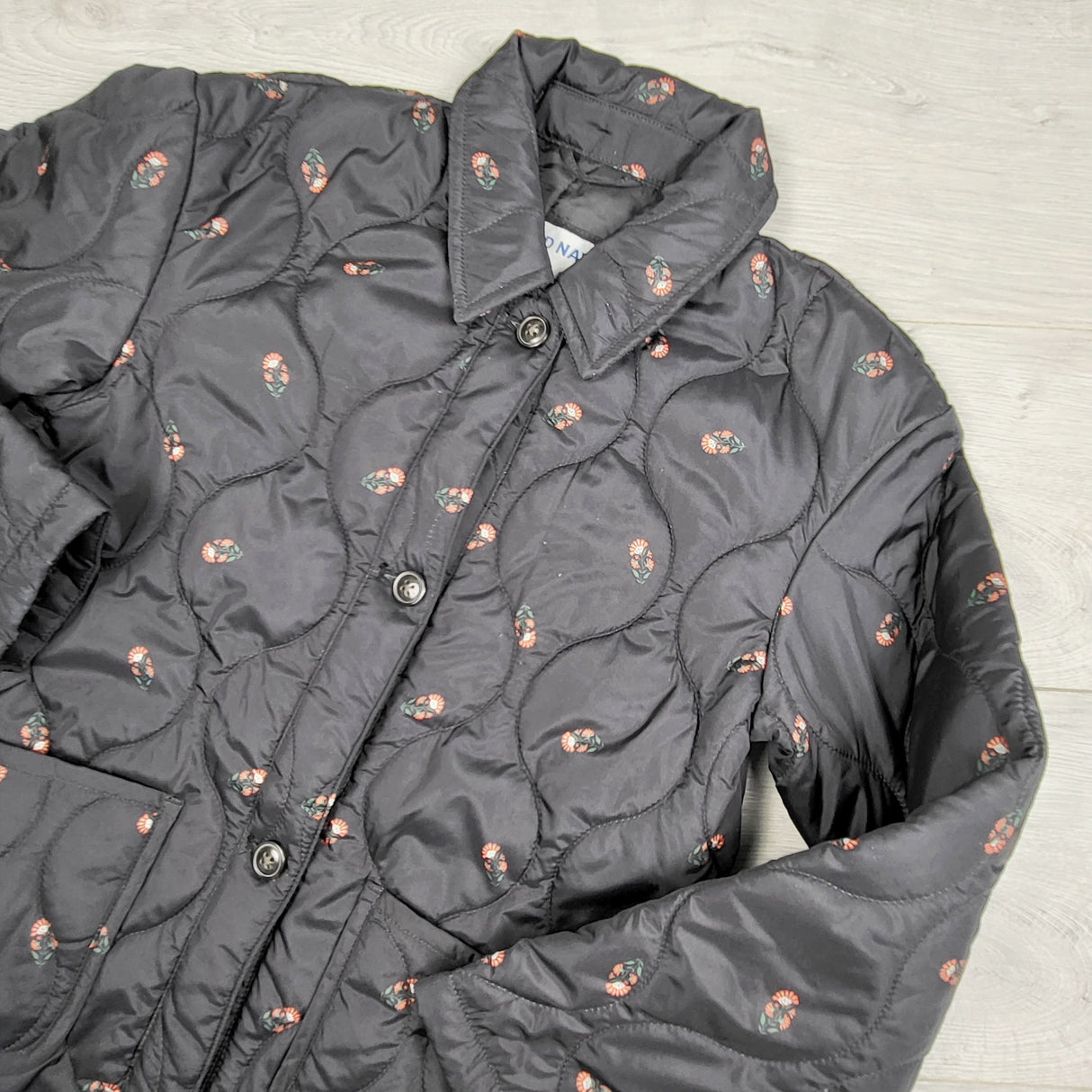 HWIL1 - Old Navy black floral printed quilted water resistant jacket. Size 10/12