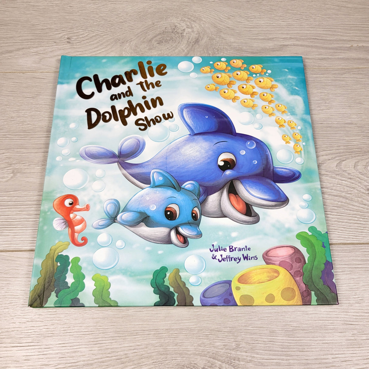 KHEN1 - Charlie and the Dolphin Show. Hardcover book