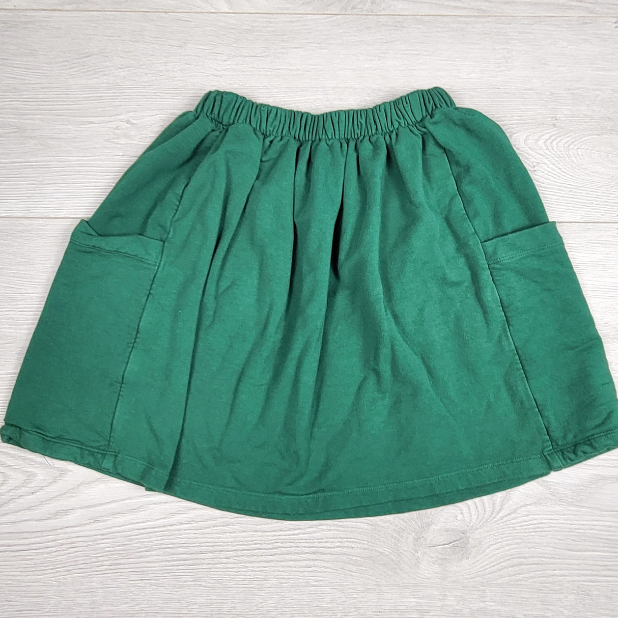 BNG1 - Haven Kids green bamboo/cotton blend elastic waist skirt. Size 6/7 🍁