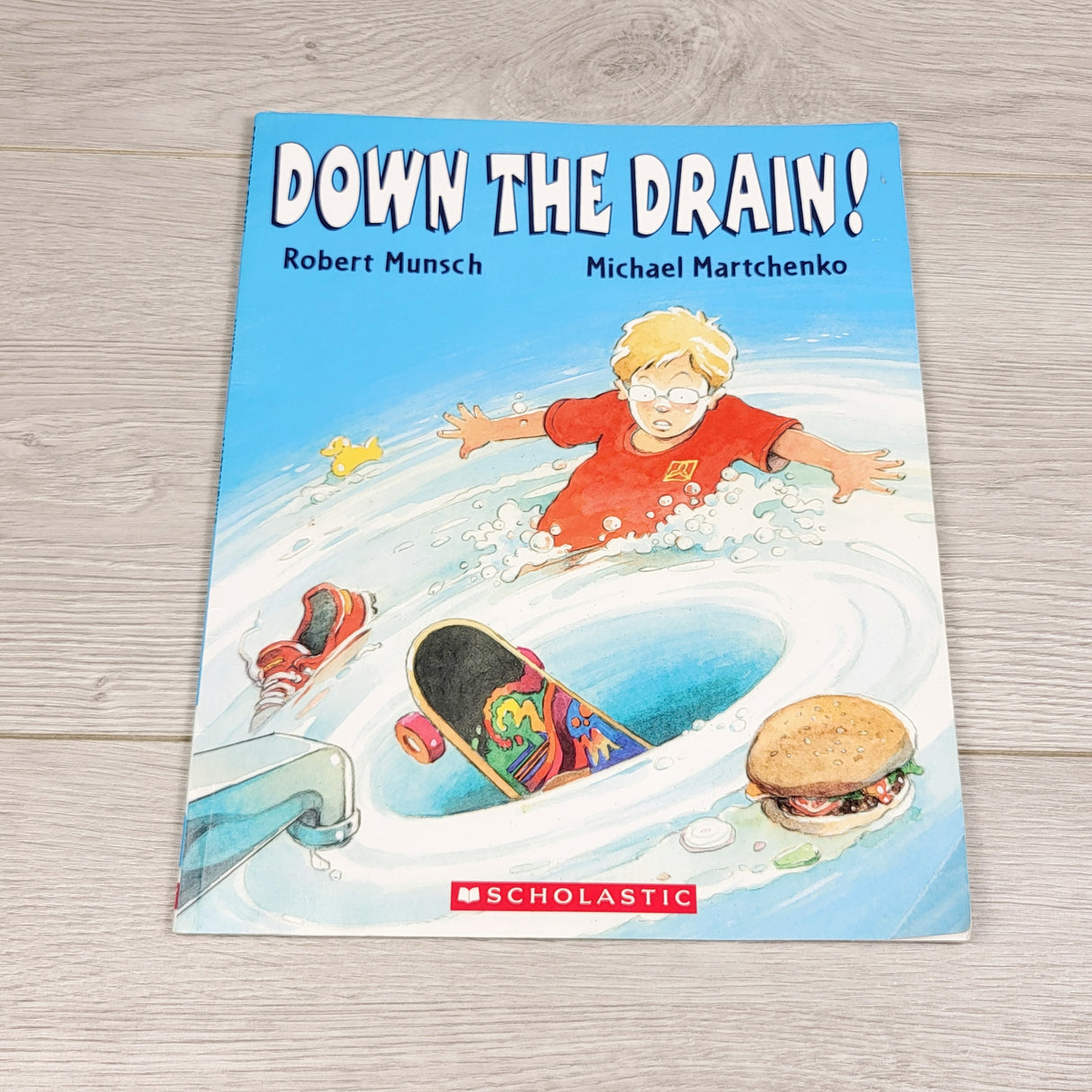 OAG22 - Down the Drain. Soft cover book
