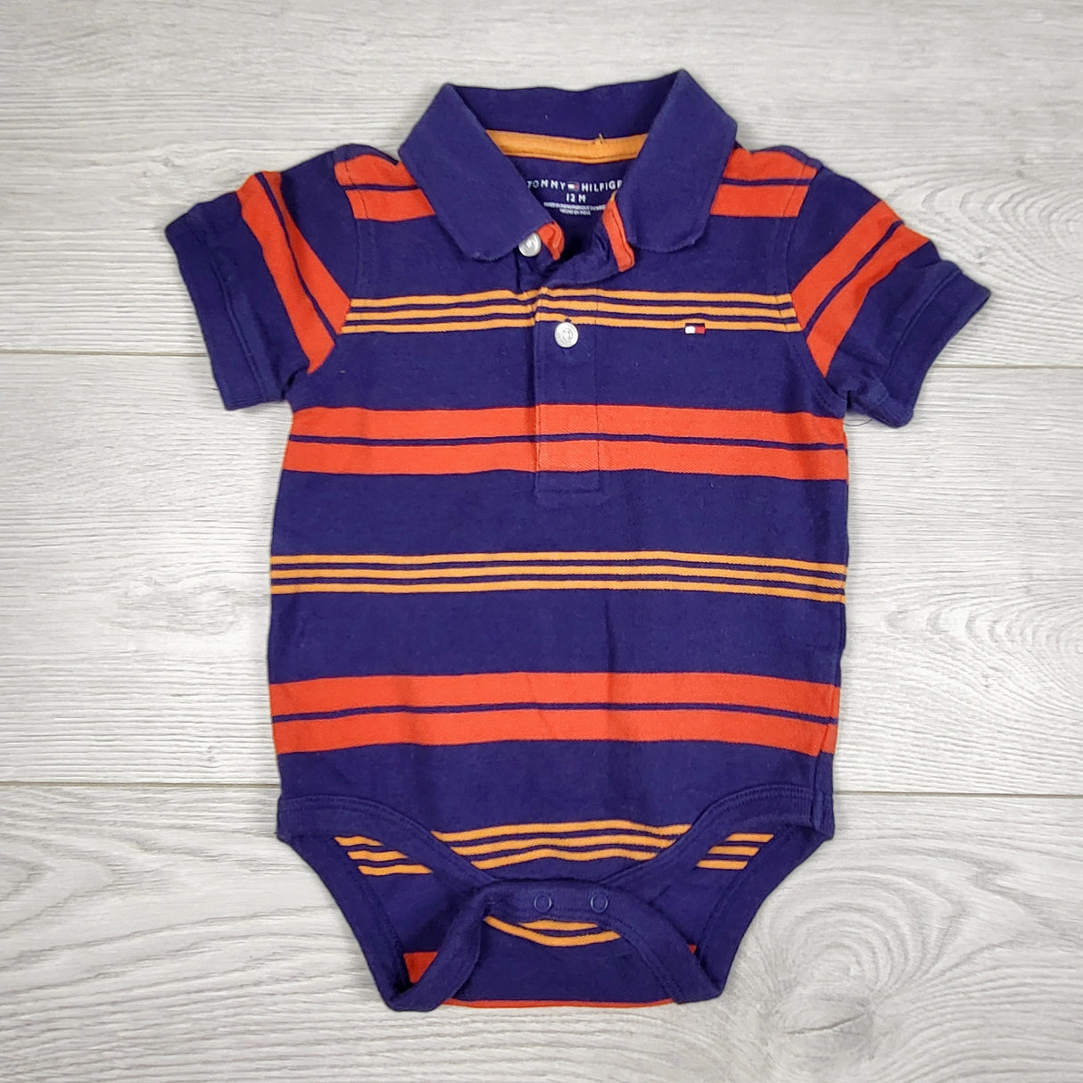 KDEL33 - Tommy Hilfiger navy striped polo bodysuit. Size 12 months