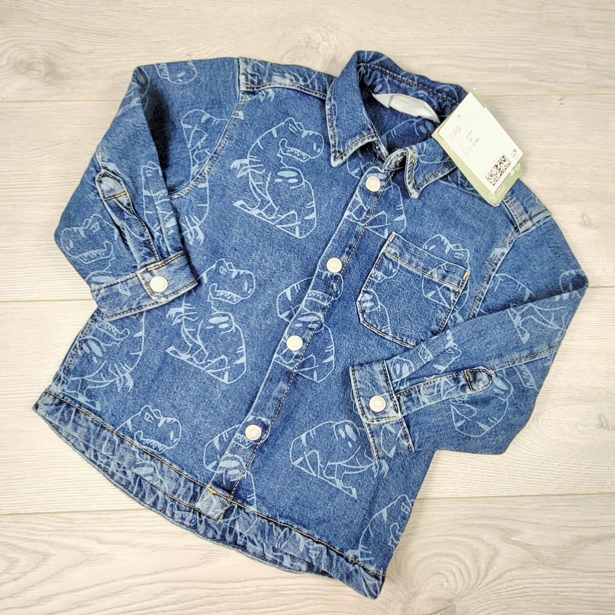 GFST1 - NEW - H and M snap button denim overshirt with dinosaurs. Size 2/3T