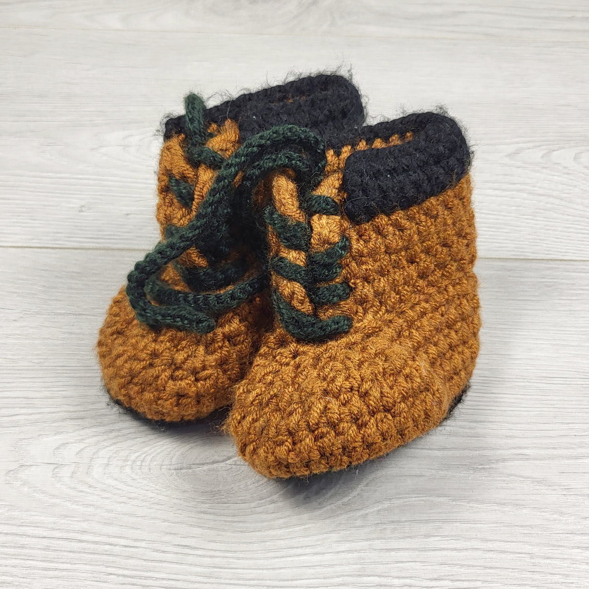 KARE3 - Handmade tan and black booties. Approx 0-6 months