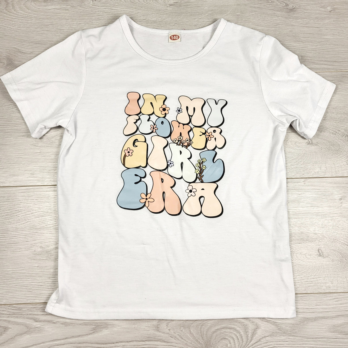 APPL1 - White "In My Flower Girl Era" t-shirt. Size 8/9