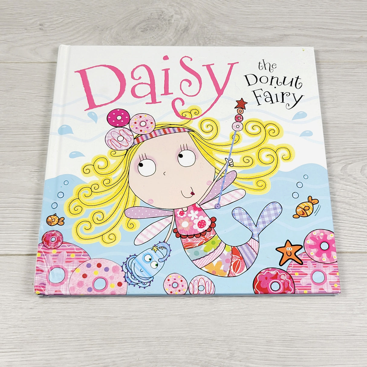 CMRD1 - Daisy the Donut Fairy. Hardcover book