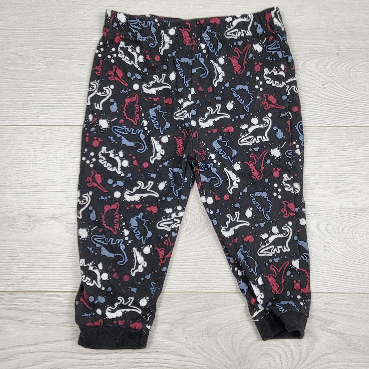 COHI1 - Arie by Ariella black splatter pattern dinosaur pants. Size 12 months