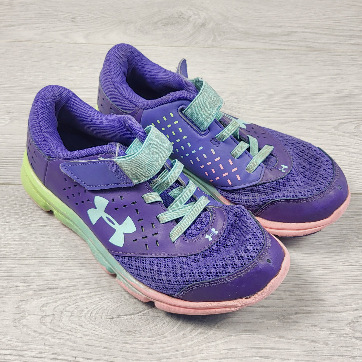 KBRD1 - Under Armour purple running shoes. Youth size 1