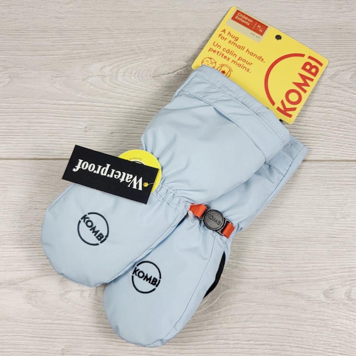 MCX1 - NEW - Kombi light blue mittens. Size 4/5T