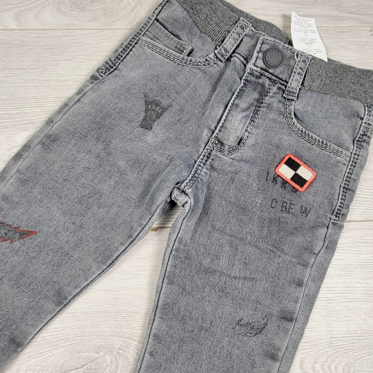 MCX1 - IKKS grey distressed pull on jeans with racing theme. Size 2T
