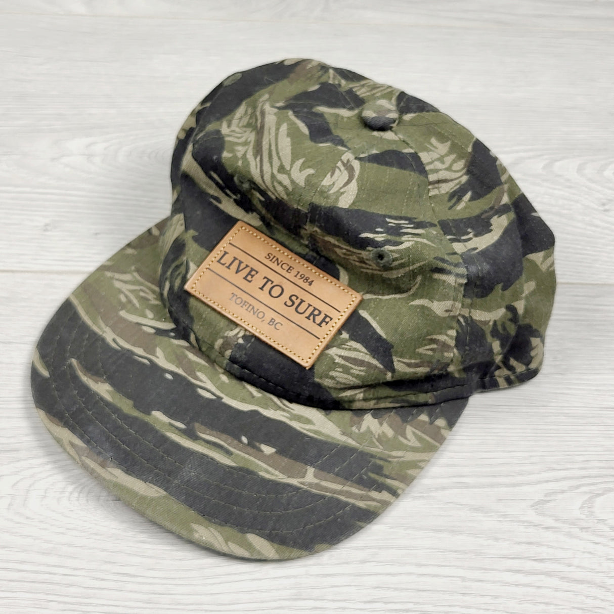 TAMC1 - Live to Surf camouflage Tofino cap. One size fits all (older kids + adults)