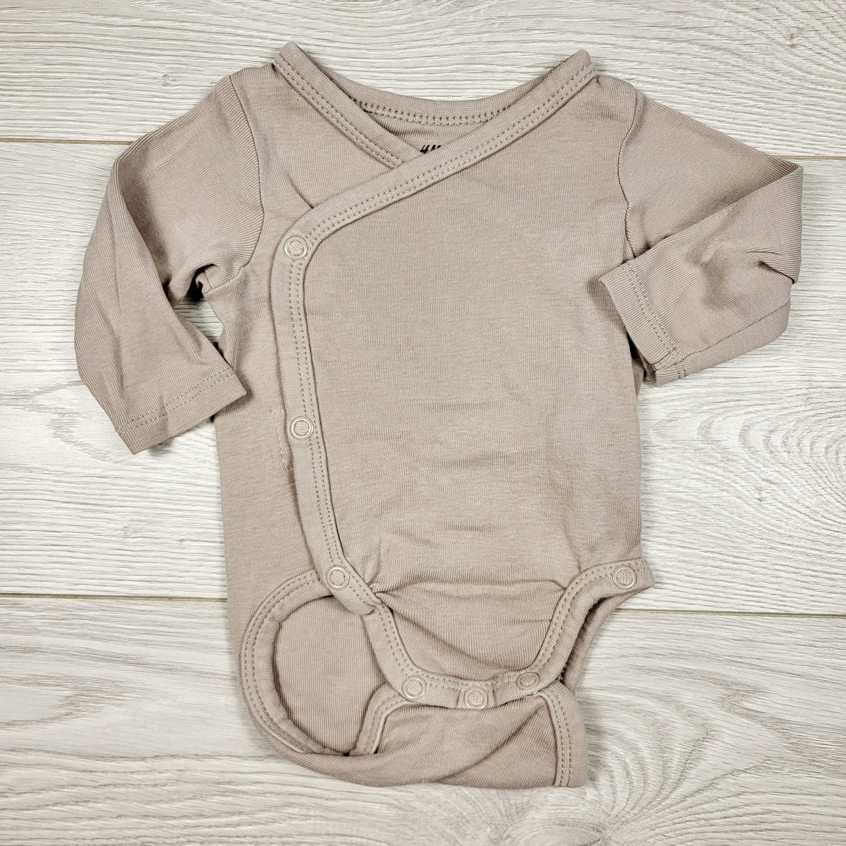 RBEN1 - H and M sand coloured wrap style bodysuit. Size 1-2 months