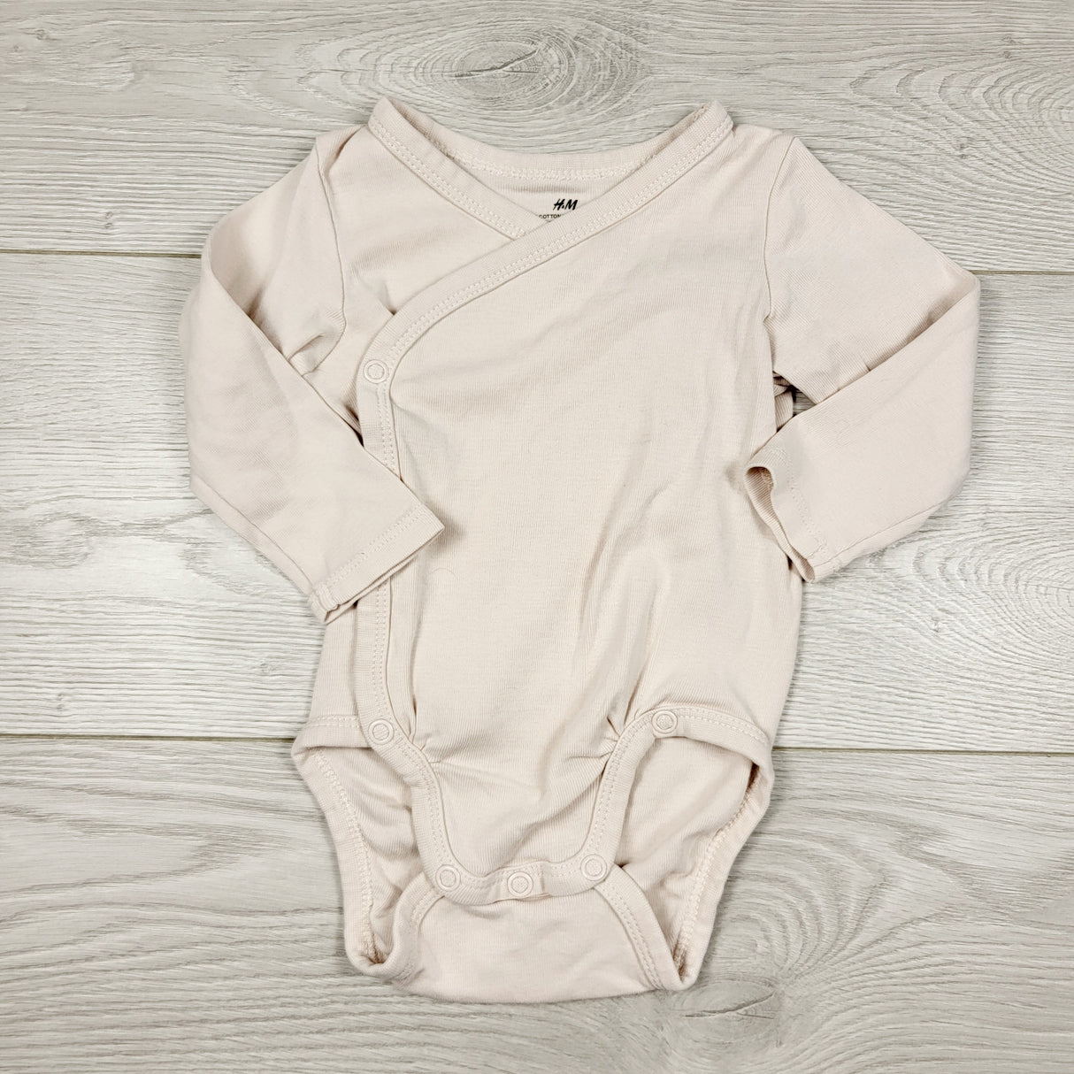 RBEN1 - H and M light pink wrap style bodysuit. Size 2-4 months