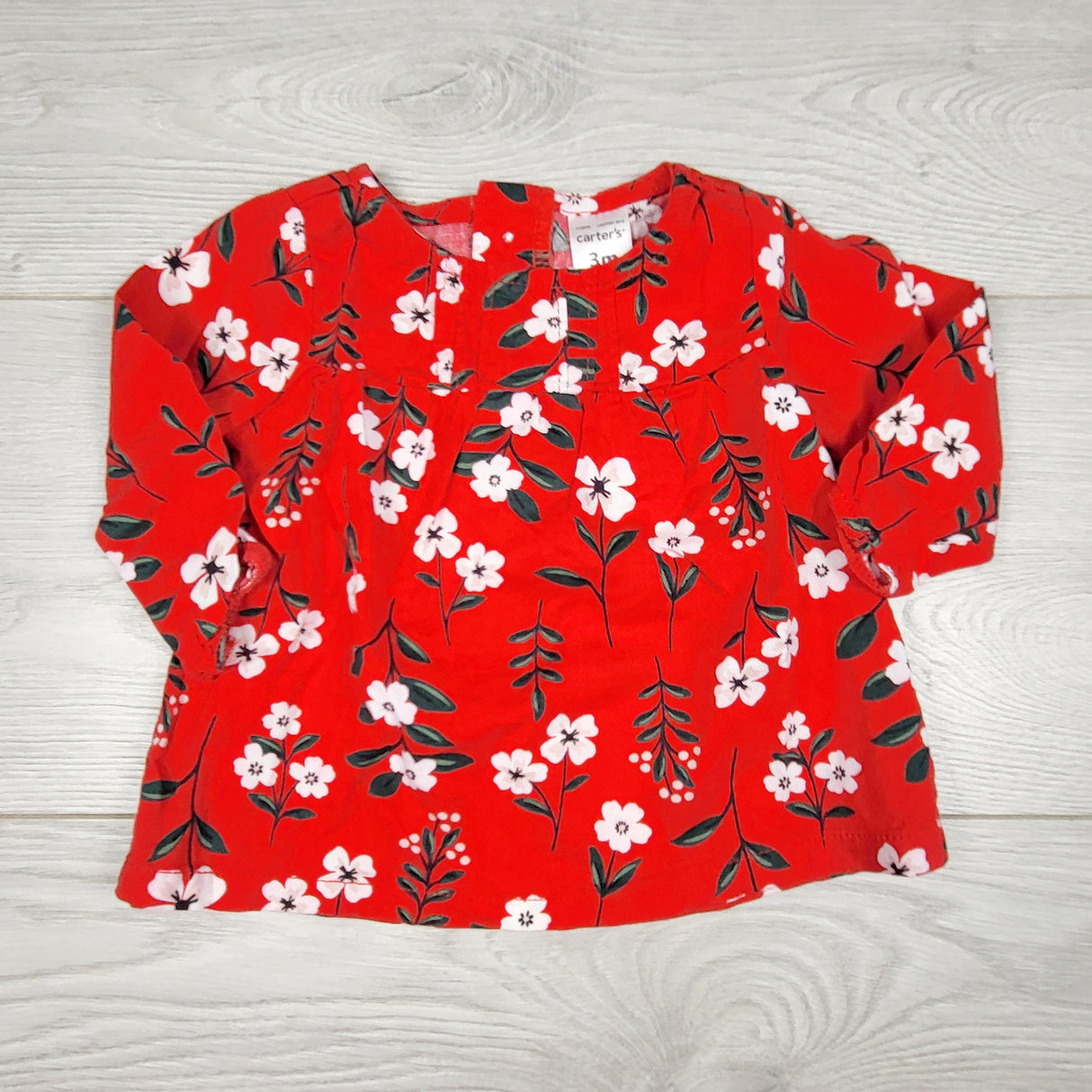ECRS11 - Carters red long sleeved floral top. Size 3 months