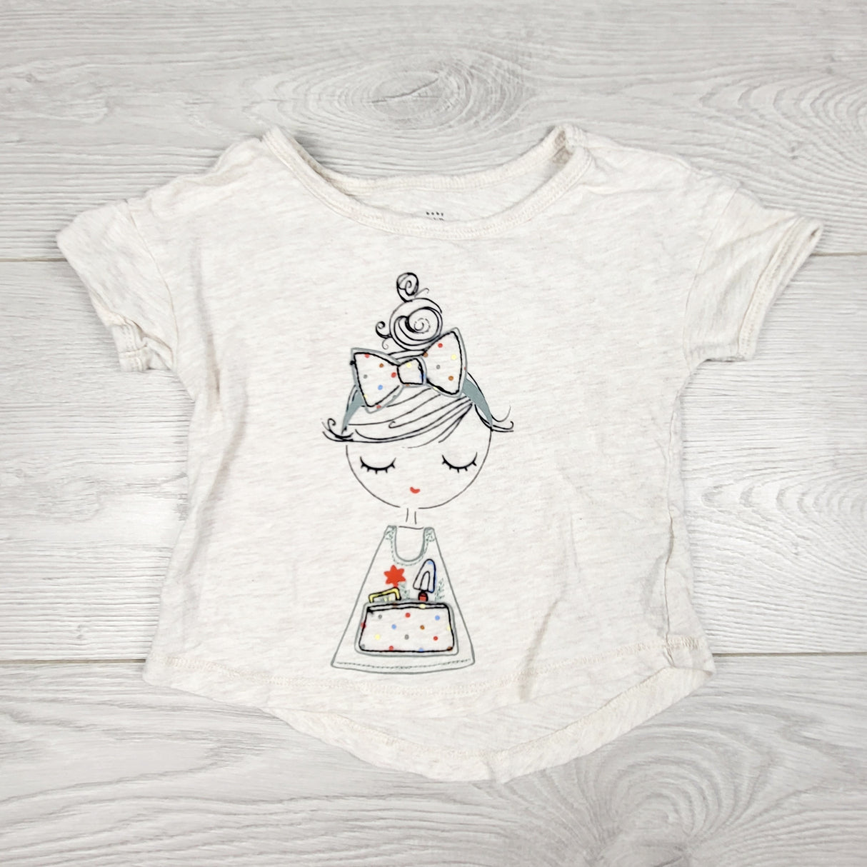ECRS11 - Gap beige t-shirt with girl holding purse. Size 6-12 months