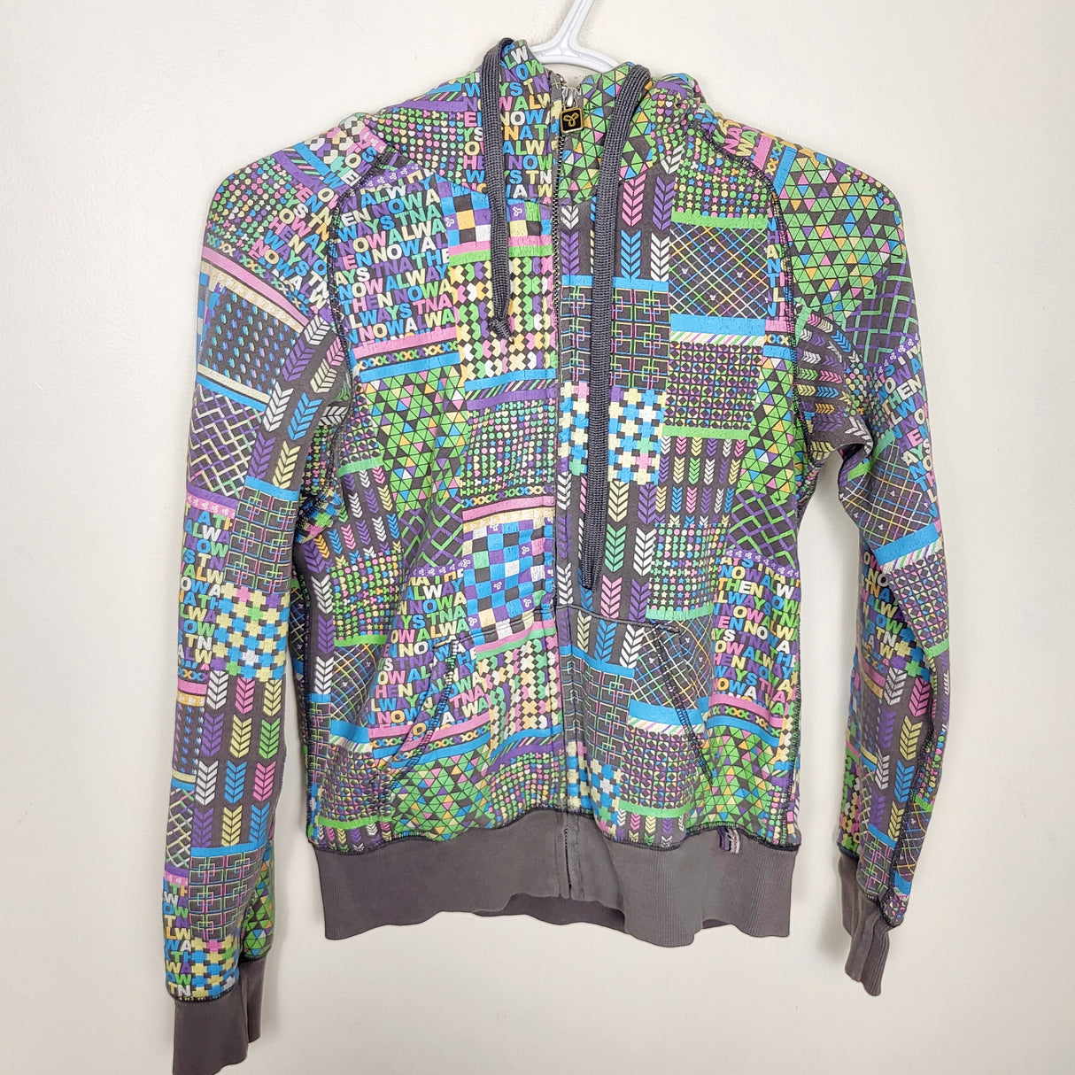 MAWA1 - TNA grey patterned zip up hoodie. ADULT size XS