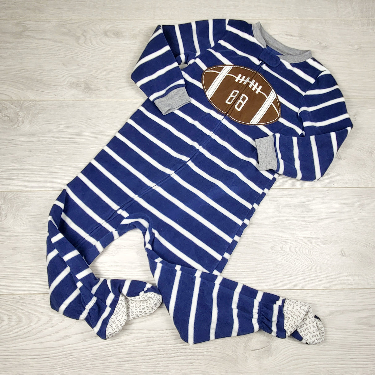 JLSN1 - Carters navy zippered fleece sleeper with football. Size 3T