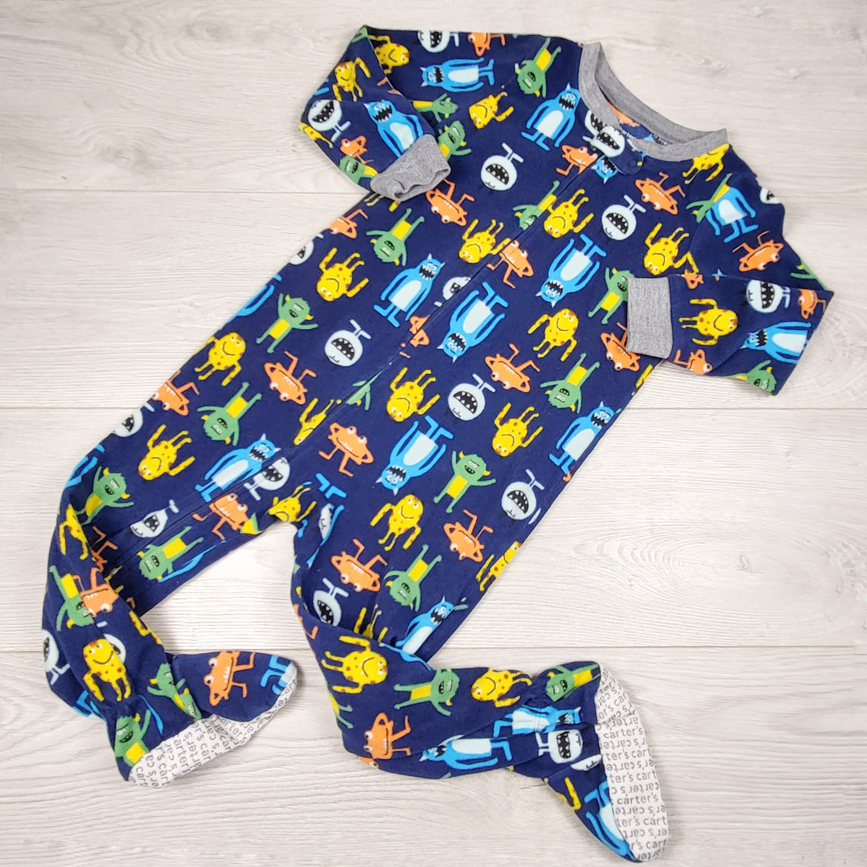 JLSN1 - Carters navy zippered fleece sleeper with monsters. Size 3T