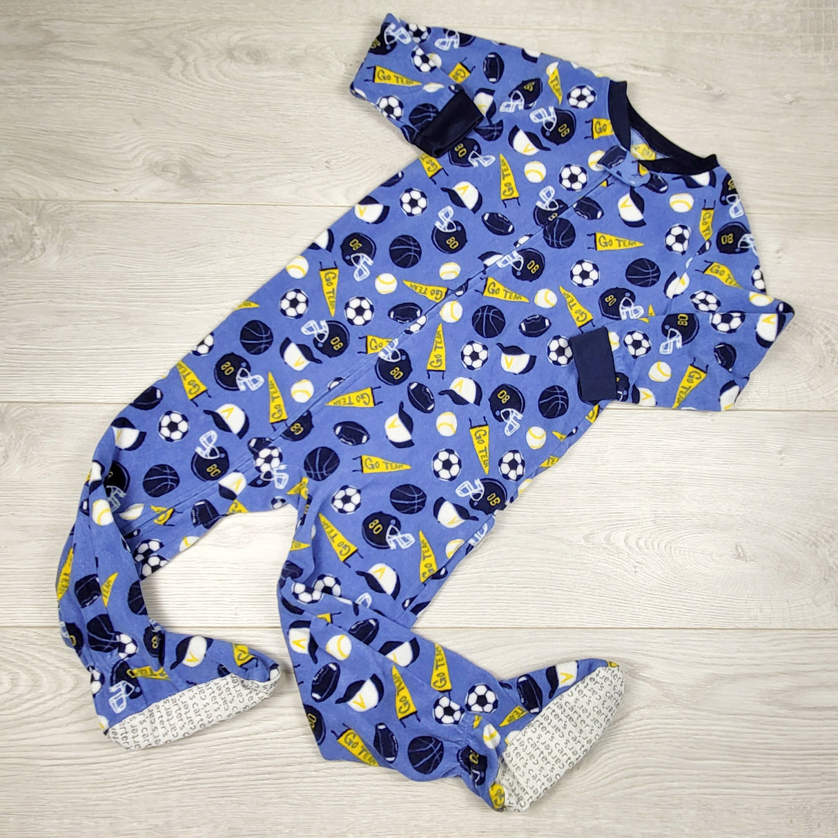 JLSN1 - Carters blue zippered fleece sleeper with soccer theme. Size 3T