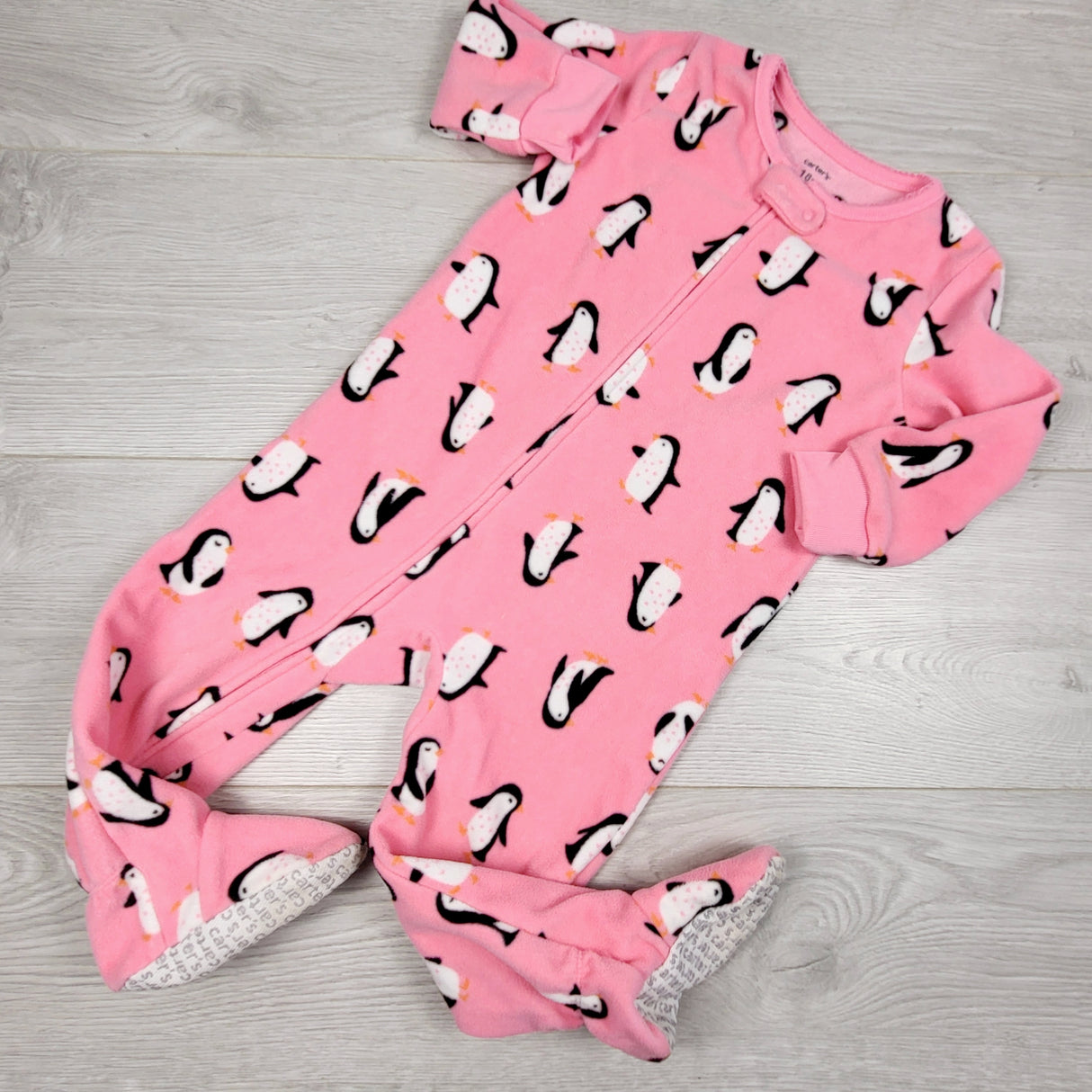 ADMX11 - Carters pink zippered fleece sleeper with penguins. Size 18 months