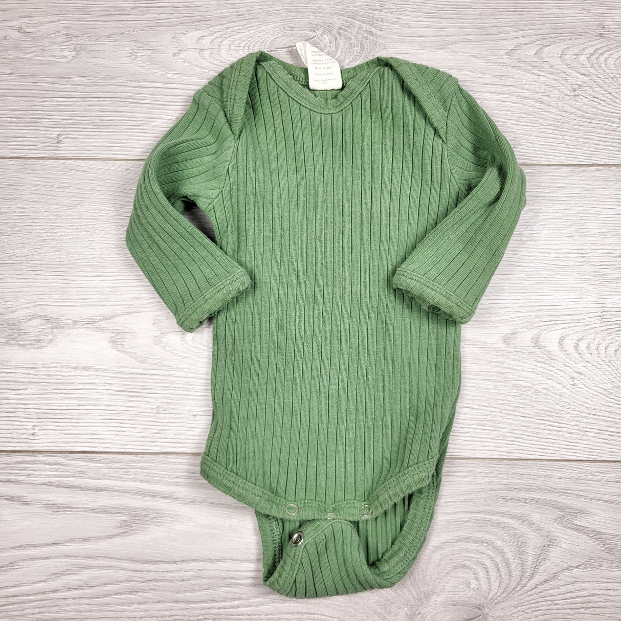 CCAM1 - Kate Quinn green ribbed cotton bodysuit. Size 0-3 months