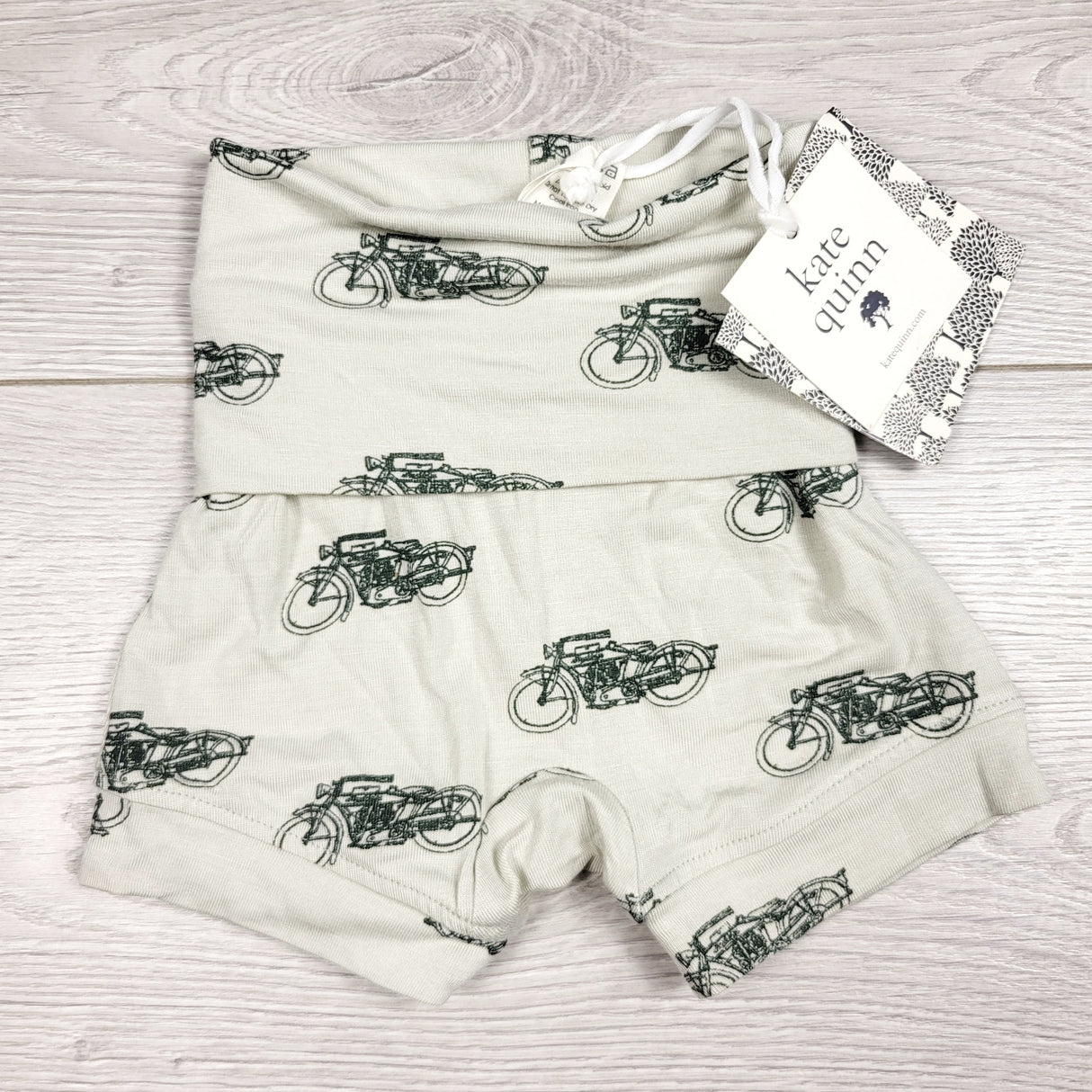 CCAM1 - NEW - Kate Quinn pale green bamboo shorts with motorcycles. Size 0-3 months